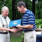 Joe Barlow receives a citation from Virginia Commissioner of Agriculture and Consumer Services Matthew Lohr at an Agricultural Council meeting this week.