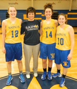 Nansemond-Suffolk Academy's Kim Aston won TCIS Coach of the Year and stands with her All-TCIS players, from left: Harper Birdsong, Jessica Pieroni and Macy Mears.