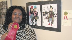 Jenise Stovall shows off her second-place-winning work in the Suffolk Art League’s annual Exhibit of Excellence.