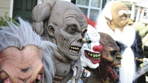 Dozens of fiendish heads were featured at Ken and Karen Campbell's "Halloween in July" garage sale.