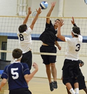 Lakeland High School freshmen Josh Bennett, No. 8, and Cody Anderson, No. 3, defend against visiting Nansemond River High School on Tuesday night as sophomore Kyle Stuart, No. 5, looks on. (Melissa Glover photo)