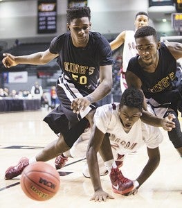 I.C. Norcom High School’s Travis Ingram reacts to having his hand stepped on as he and King’s Fork players Christopher Roscoe and Dale Roscoe go after a loose ball Saturday at the Stuart C. Siegel Center at Virginia Commonwealth University. The Bulldogs lost the state championship game 52-40.