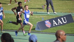 Chase Osborne of Chesapeake, who practices in Suffolk, competes in the 14-year-olds division of the boys' 1500-meter run on Aug. 4 at Norfolk State University. He placed 36th out of 75 runners with a time of 4:41.85. (Lou Pollard photo)