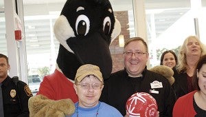 During Wawa’s grand opening, Wally, the giant Canada goose that is the company’s mascot, gets friendly with Spencer Holt, representing Special Olympics Virginia, and Wawa manager James Keller Jr. 