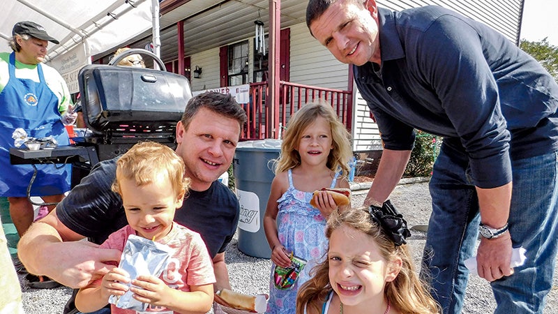 From left, Ira Foltz, Ryan Foltz, Deborah Foltz, Ivana Foltz and Luke Foltz are all smiles during Driver Days on Saturday.