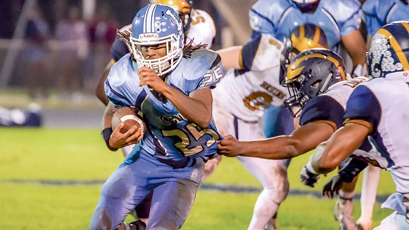 Lakeland High School senior Damontra Milteer carries the ball in a previous game. 