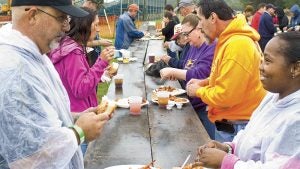 Rain didn't slow down fairgoers at the Suffolk Ruritan Club Shrimp Feast. They simply donned ponchos and hoodies and kept on peeling.