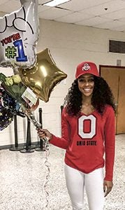 Syaira Richardson shows off her Ohio State University attire after announcing her commitment to run track there during a ceremony Wednesday. She will attend Ohio State in 2017.