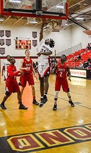 Jeremiah Lewis scores two of his 16 points against Gloucester Wednesday night. The Warriors fell to the Dukes 67-64 in overtime. Linda Lewis photo  