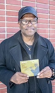 Connell C. Kahan shows off his first CD, “It’s My Time.”